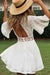 Mujer joven con vestido blanco corto al estilo ibicenco